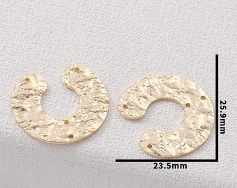 May include: Two gold-coloured, hammered-texture crescent-shaped metal components. Each piece has multiple small holes for attachment. The dimensions are 2.35cm wide and 2.59cm tall.