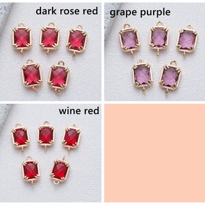 May include: Three sets of gold-toned metal charms with square-shaped red, purple, and wine-coloured glass stones. The charms have a loop at the top for attaching to jewellery or other crafts.