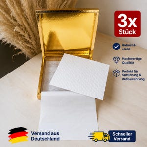 Doos met 16 gouden chocolaatjes