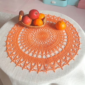 Bright orange large and cheerful lace crochet doily