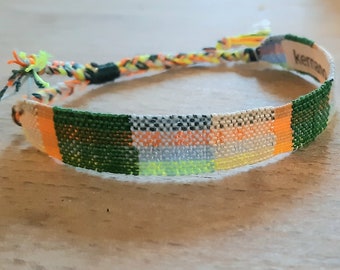 Hand-woven bracelet: "No spring for Marni", pale blue cotton threads, spring green, beige and coral tips