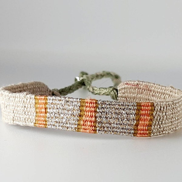 The "Gouter chez Angelina": Hand-woven bracelet, twine linen thread, salmon silk thread, mustard thread, silver lurex thread