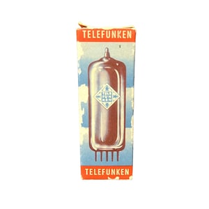 May include: A vintage Telefunken vacuum tube in a blue and white box with red lettering. The box has the Telefunken logo on the front and the words "Telefunken" on the top and bottom.