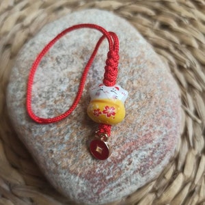 Maneki Neko ceramic lucky charm, mini lucky cat, gri-gri, talisman, to hang. Yellow. Peace.