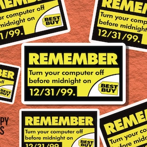 May include: A yellow and black reminder sticker with the text "REMEMBER Turn your computer off before midnight on 12/31/99." and a Best Buy logo.