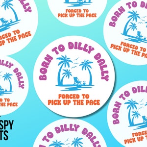 May include: A white circle sticker with a pink, orange, and blue design. The sticker features a beach scene with palm trees, a lounge chair, and the text "Born to Dilly Dally" in a pink and orange font. The text "Forced to Pick Up the Pace" is written in orange below the beach scene.