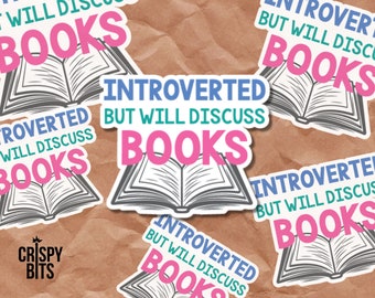 May include: Five stickers with an open book design and the text "Introverted but will discuss books". The stickers are on a brown paper background.