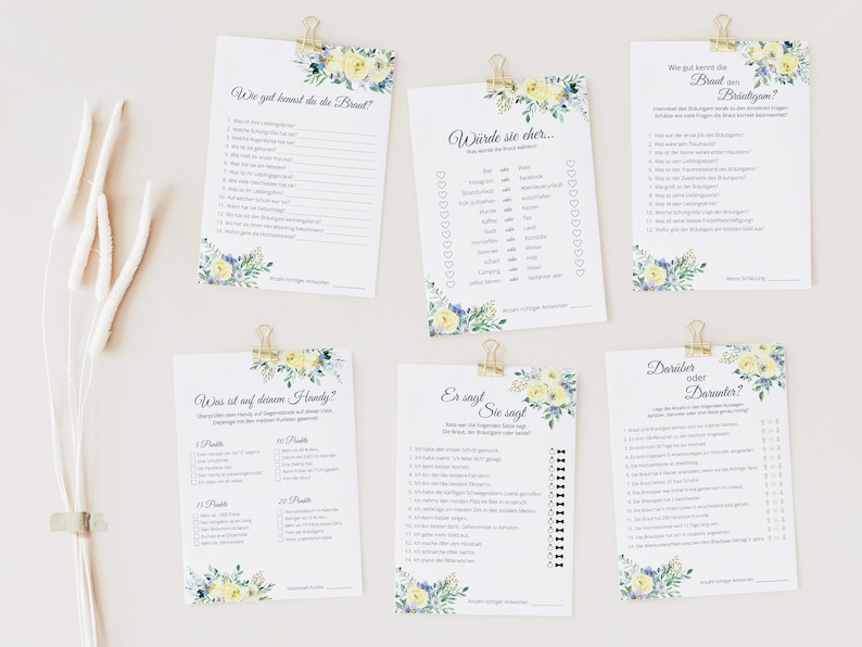 May include: A set of printable bridal shower game cards with a floral design featuring yellow and blue flowers. The cards include questions like "How well do you know the bride?" and "What's on her phone?"
