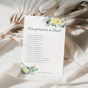 May include: A printable bridal shower game card with the title "Wie gut kennst du die Braut?" (How well do you know the bride?) and a list of 14 questions about the bride. The card is decorated with yellow and blue flowers.