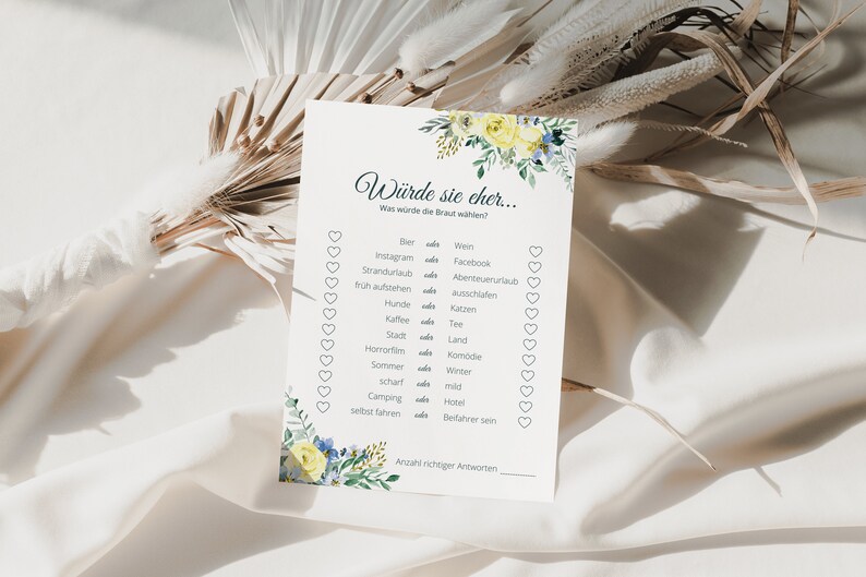 May include: A printable bridal shower game with a floral design in shades of yellow and blue. The game asks "Would she rather..." and lists a series of questions with two choices each.  The game is designed to help guests learn more about the bride.