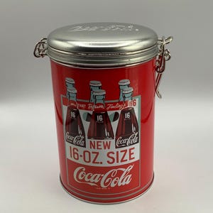 2009.  COCA-COLA Advertising  Tin.  &quot;New 16-OZ. Size&quot;.  Coke Collectible.