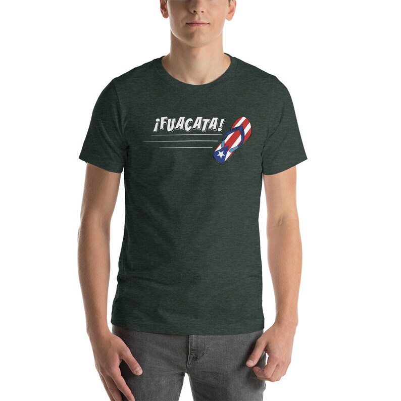May include: A dark green t-shirt with a white graphic of a flip-flop with the Puerto Rican flag colors and the text "&iexcl;FUACATA!"