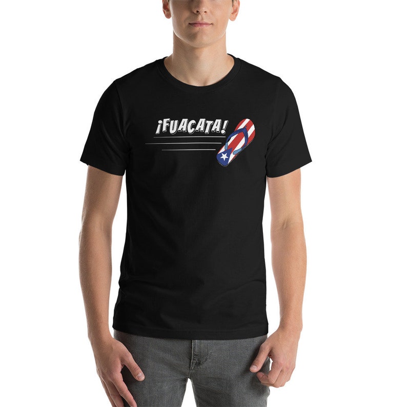 May include: Black t-shirt with a white graphic of a flip-flop with the Puerto Rican flag design and the text "&iexcl;FUACATA!"
