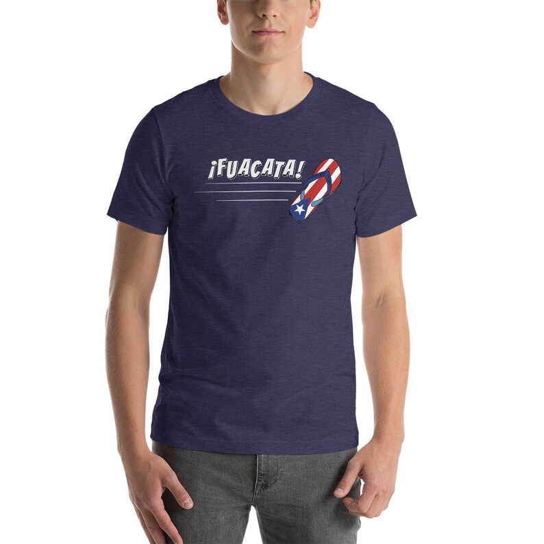 May include: A navy blue t-shirt with a white and red flip-flop design and the text "&iexcl;FUACATA!" in white.