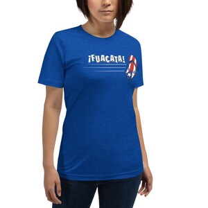 May include: A royal blue t-shirt with the text "&iexcl;FUACATA!" and a red, white, and blue flip-flop with a star on it.