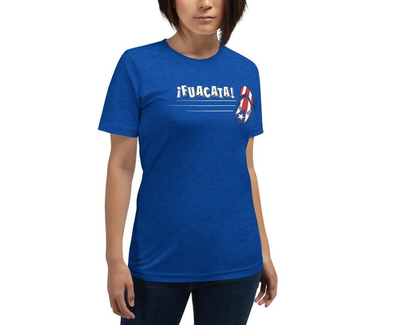 May include: A royal blue t-shirt with the text "&iexcl;FUACATA!" and a red, white, and blue flip-flop with a star on it.