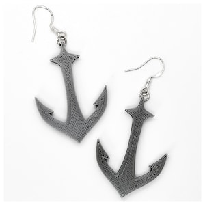 May include: A pair of silver anchor earrings. The anchors are detailed and have a textured finish.