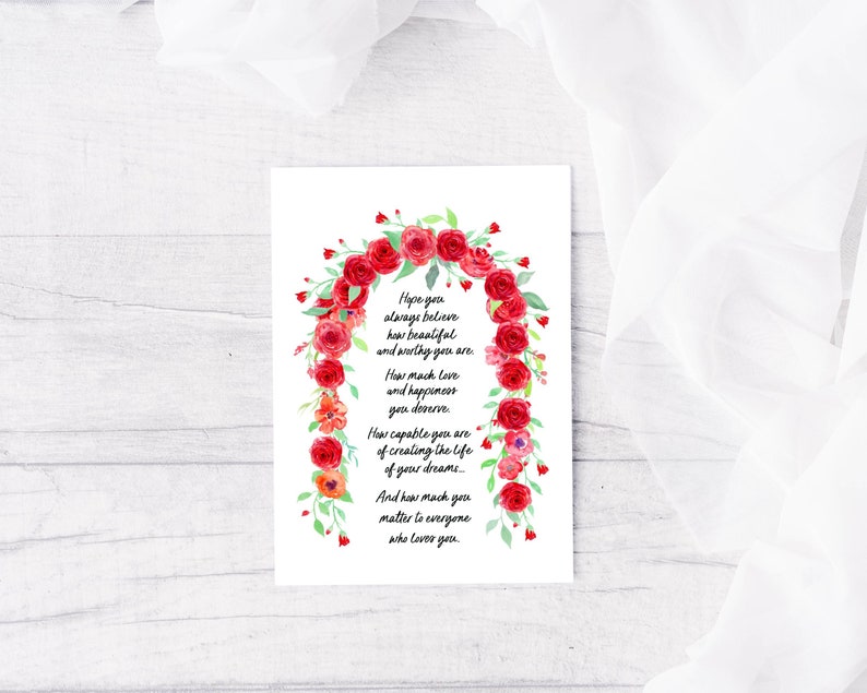 May include: A watercolor illustration of a red rose arch with a handwritten message that reads: "Hope you always believe how beautiful and worthy you are. How much love and happiness you deserve. How capable you are of creating the life of your dreams. And how much you matter to everyone who loves you."
