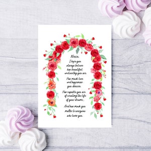 May include: A white card with a red floral border and a handwritten message that reads: "Nieces, I hope you always believe how beautiful and worthy you are. How much love and happiness you deserve. How capable you are of creating the life of your dreams... And how much you matter to everyone who loves you."