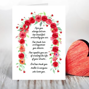 May include: A white card with a watercolor illustration of a red rose garland. The card has a message that reads: "Hope you always believe how beautiful and worthy you are. How much love and happiness you deserve. How capable you are of creating the life of your dreams... And how much you matter to everyone who loves you."