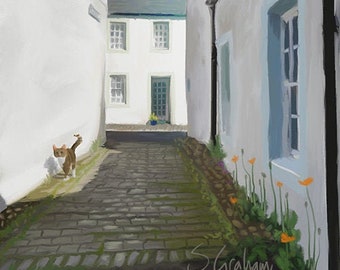 May include: A white cat walks down a cobblestone alleyway between two white buildings. The buildings have windows and doors. The sky is blue and there are green plants growing along the side of the buildings.