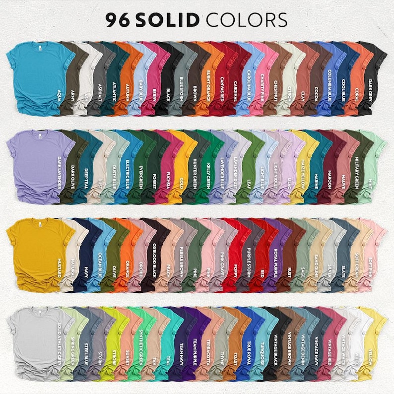 K&ouml;nnte beinhalten: Darstellung von 96 einfarbigen T-Shirts, in Reihen angeordnet. Jedes Shirt hat eine andere Farbe, von hellen Pastellt&ouml;nen bis zu dunklen Farbt&ouml;nen. Der Text "96 SOLID COLORS" steht oben.