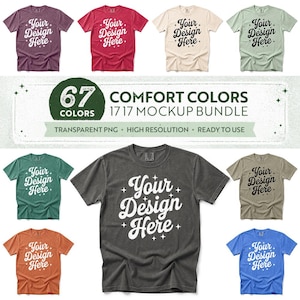 May include: A collection of short-sleeve t-shirts in various colours including purple, red, cream, light green, teal, dark grey, tan, orange, and blue. Each shirt features the text Your Design Here in a stylised font with small star accents.
