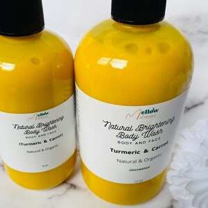 May include: Two yellow plastic bottles of natural brightening body wash with a turmeric and carrot scent. The bottles are labeled "Mellow Naturals" and are 8 oz and 12 oz.