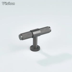 May include: A dark gray cabinet pull with a textured, diamond-patterned handle. The pull has a cylindrical handle and a round base. The word "Vision" is in the top left corner.