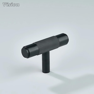 May include: A black T-shaped cabinet pull with a cylindrical handle and a vertical post. The handle has a textured, ridged design. The word "Vision" is in the upper left corner.