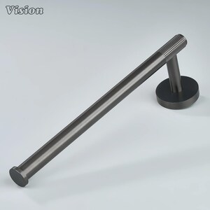 May include: A dark gray metal towel bar with a round base and a cylindrical bar. The end of the bar has a small, flat, circular cap. The bar is angled, and the end that attaches to the wall has a series of vertical lines.