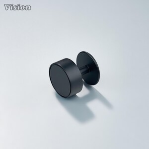 May include: A black, cylindrical wall hook with a circular base and a smaller, circular mounting plate. The hook is made of a matte black material and is designed for hanging items. The word "Vision" is in the top left corner.