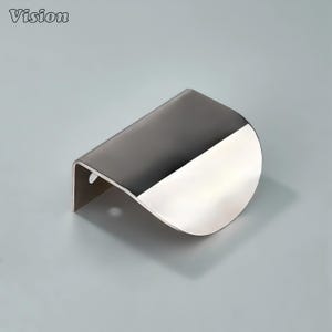 May include: A modern cabinet pull handle with a two-tone design. The top portion is a dark gray, while the bottom is a shiny silver. The handle has a curved shape and a small hole for mounting. The word "Vision" is in the top left corner.
