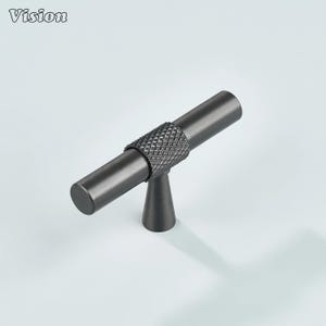 May include: A dark gray cabinet pull with a textured center section and cylindrical ends. The pull is mounted on a small, cone-shaped base. The word "Vision" is in the upper left corner.