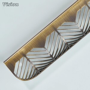 Antique Bronze plain lip pull cabinet handle with leaf detailing for drawers