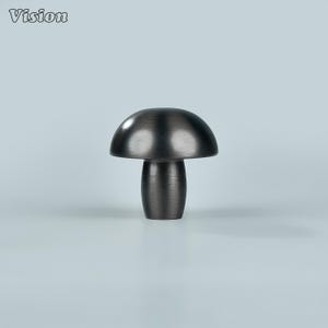 May include: A dark gray mushroom-shaped cabinet knob. The knob has a rounded top and a cylindrical base. The word "Vision" is in the upper left corner. This decorative hardware is suitable for drawers and cabinets.