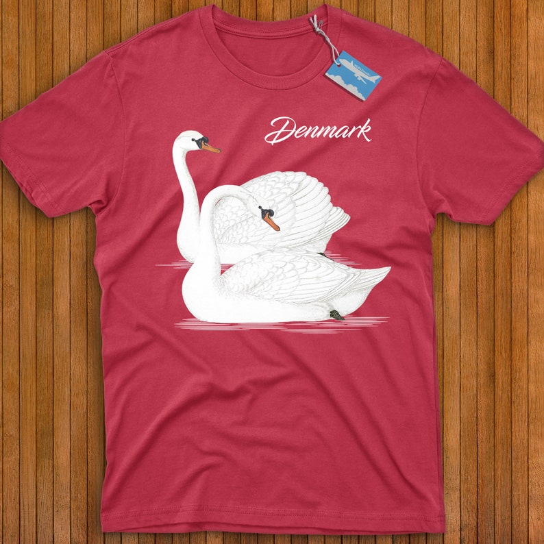 May include: Red t-shirt with a white swan design and the word "Denmark" printed on the front.