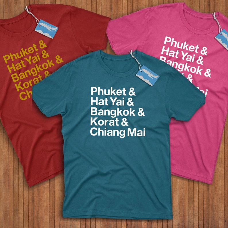 Three T-Shirts with Thai cities on them in red, blue, and pink