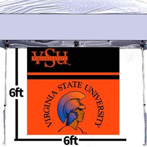 May include: A white pop-up tent with a banner featuring the Virginia State University logo. The banner is orange and black, with the university name and a Trojan head graphic. The banner is 6ft x 6ft.