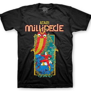 May include: Black t-shirt with a graphic of a red and yellow centipede with a human figure standing on a blue rock. The text "ATARI MILLIPEDE" is printed in yellow and red letters.