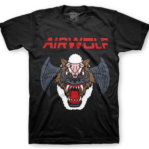 May include: Black t-shirt with a red "AIRWOLF" graphic and a cartoon image of a wolf with a sheep's head and wings.