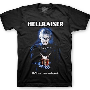 May include: Black t-shirt with a white graphic of the character Pinhead from the movie Hellraiser. The graphic shows Pinhead holding a puzzle box and the text "He'll tear your soul apart."