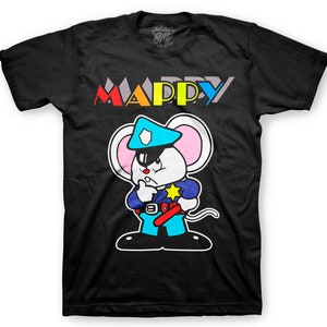 May include: Black t-shirt with a colorful "MAPPY" logo and a cartoon image of a white mouse wearing a blue police hat and uniform. The mouse is holding a red and white baton.