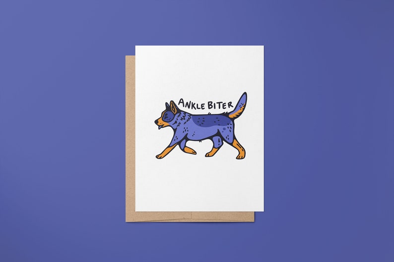 Puede incluir: Una tarjeta blanca con un perro de dibujos animados azul y naranja caminando y el texto "ANKLE BITER" encima.