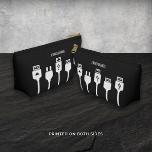 May include: Black zippered pouch with a white graphic of various cables and the text "A bunch of cables." printed on both sides.