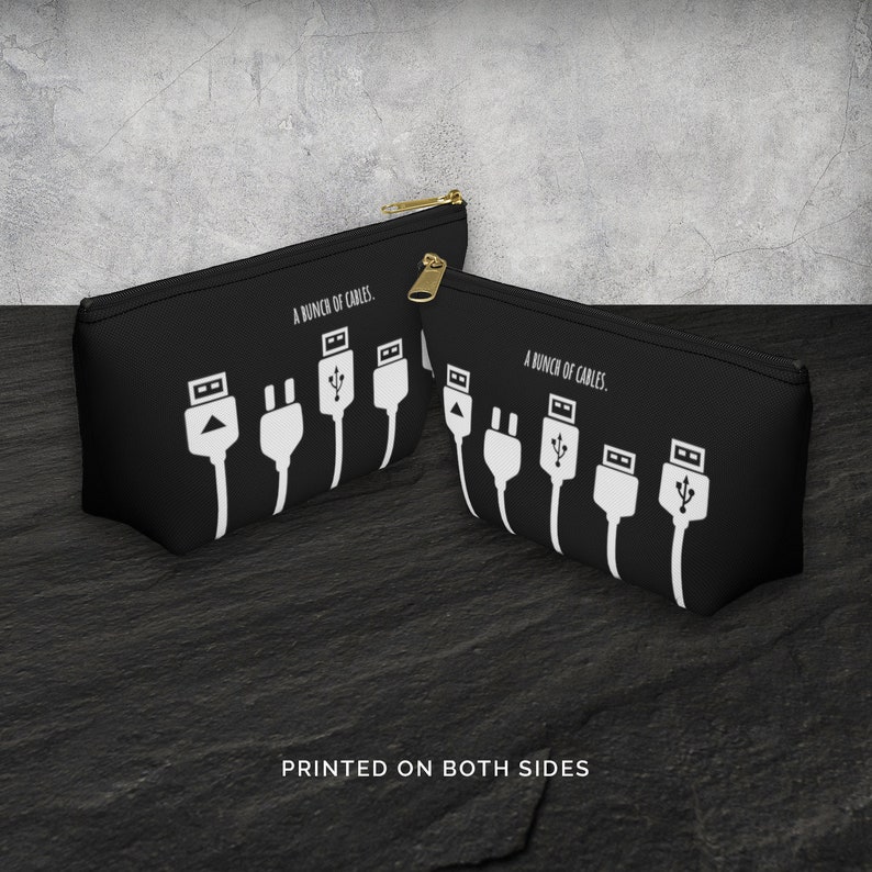 May include: Black zippered pouch with a white graphic of various cables and the text "A bunch of cables." printed on both sides.