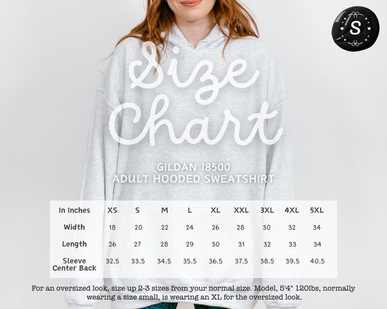 a woman wearing a sweatshirt with the size chart