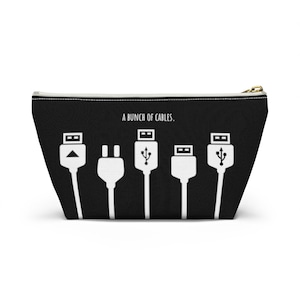 May include: Black and white zippered pouch with the text "A bunch of cables." and a graphic of five different types of cables.