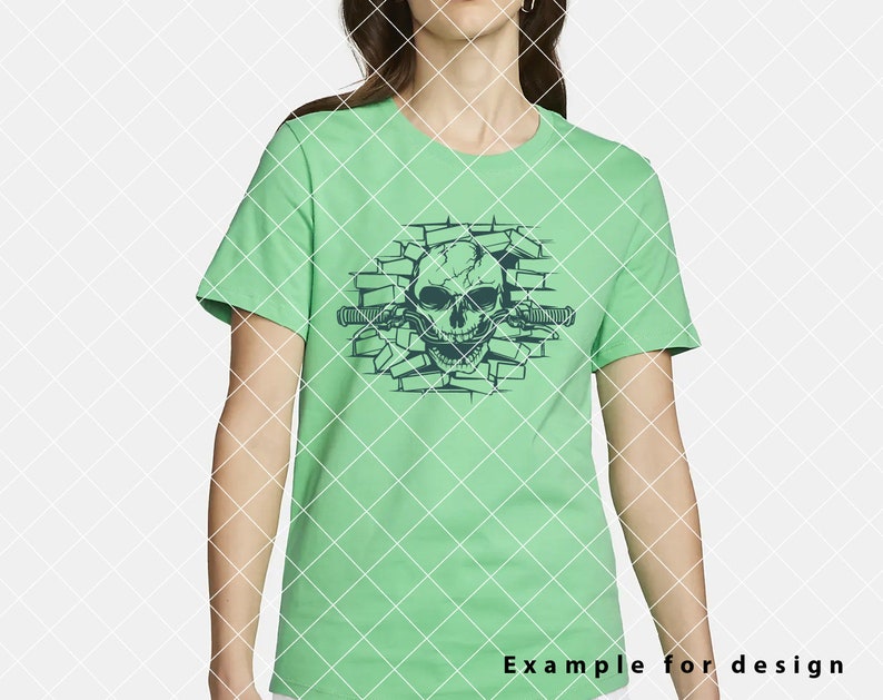 May include: A green t-shirt with a graphic of a skull breaking through a brick wall. The skull is outlined in black and has a menacing expression. The brick wall is also outlined in black.