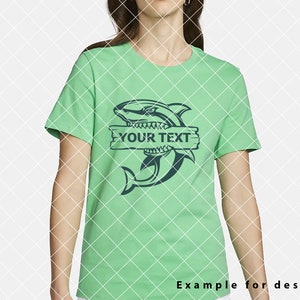 May include: A green t-shirt featuring a blue shark graphic and a wooden sign that reads "YOUR TEXT".